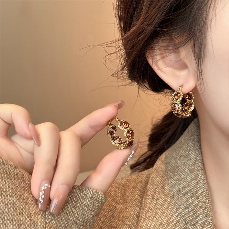 Aretes de cristal café con broche tipo botón