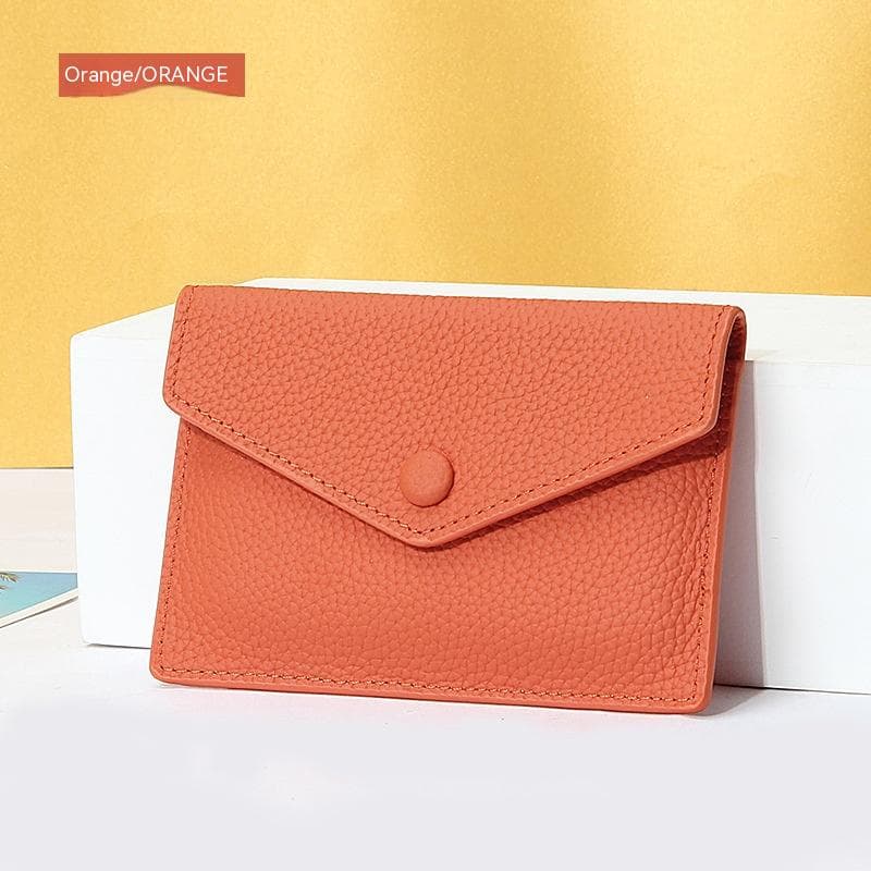 Cartera compacta de cuero con múltiples espacios para tarjetas