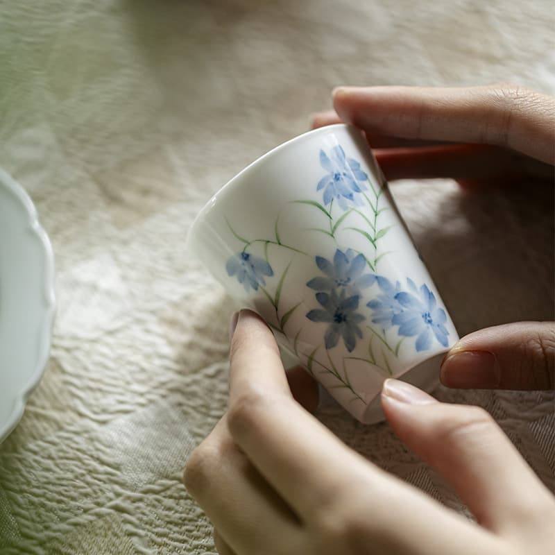 Juego de té de cerámica con pintura de flores azules
