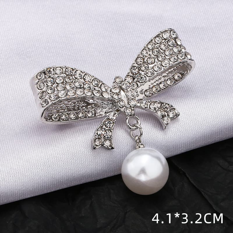 Broche decorativo lazo y flor para ropa