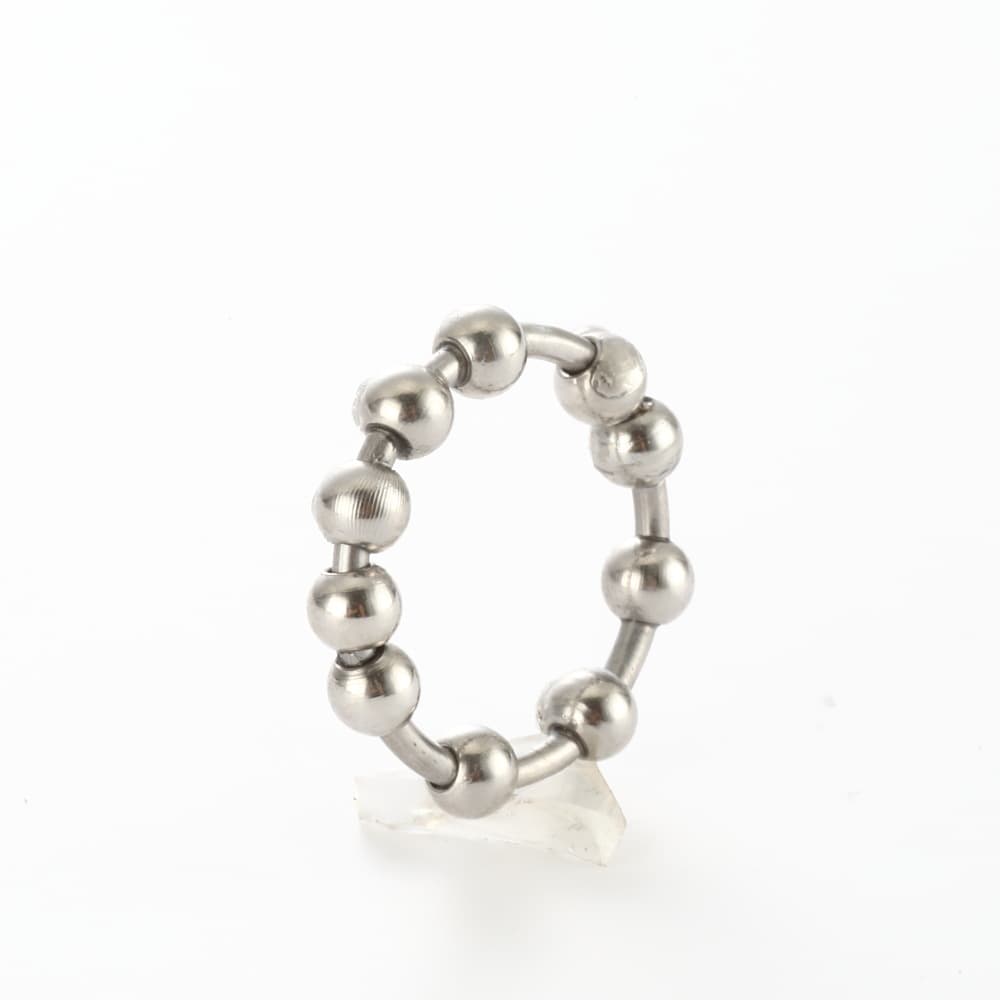Anillo de descompresión con perlas giratorias de acero