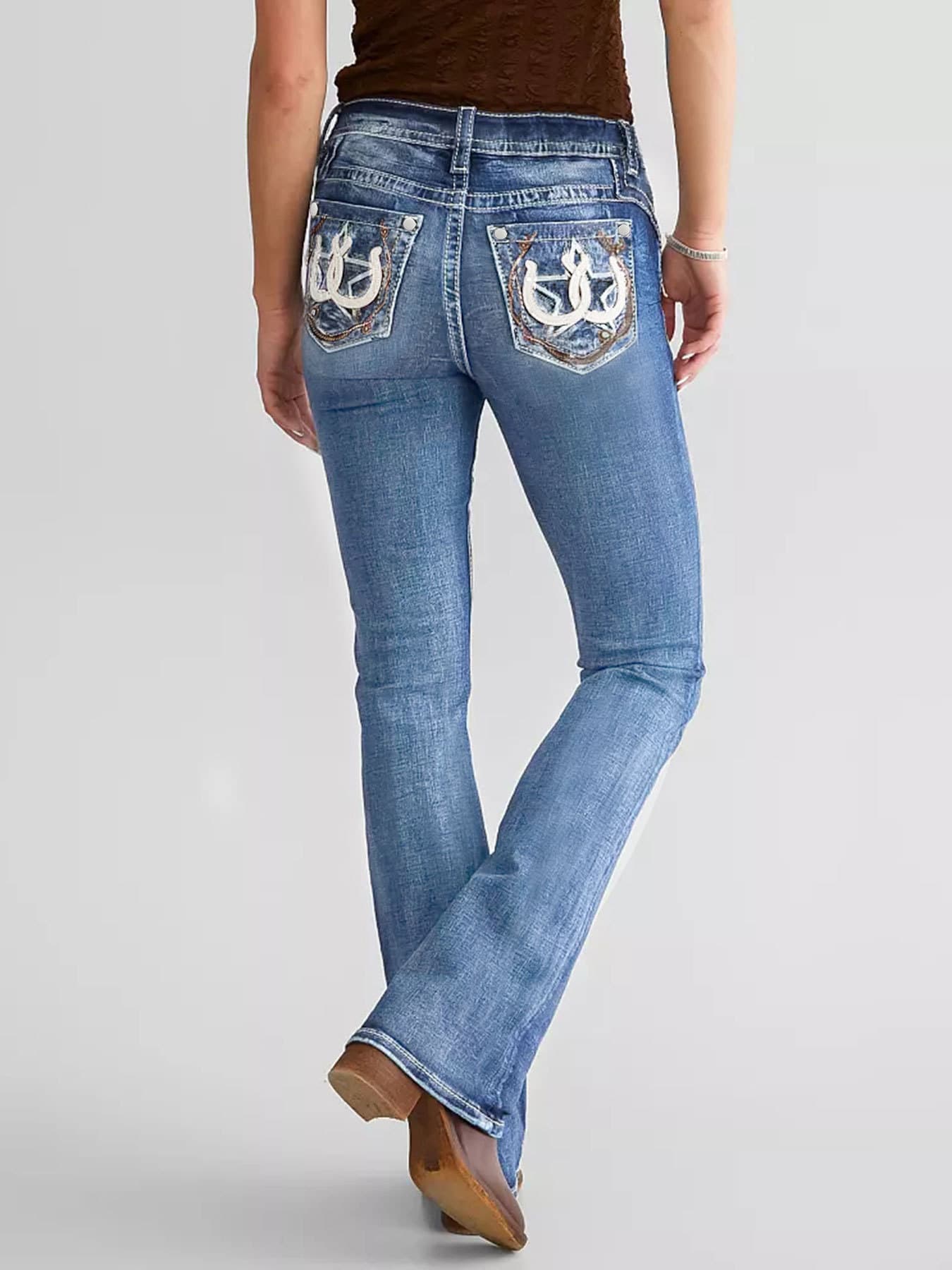 Pantalones de mezclilla slim ajustados con bordados