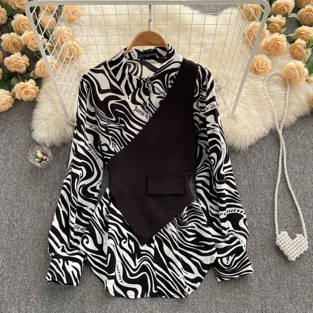 Blusa de manga larga con rayas y costuras decorativas