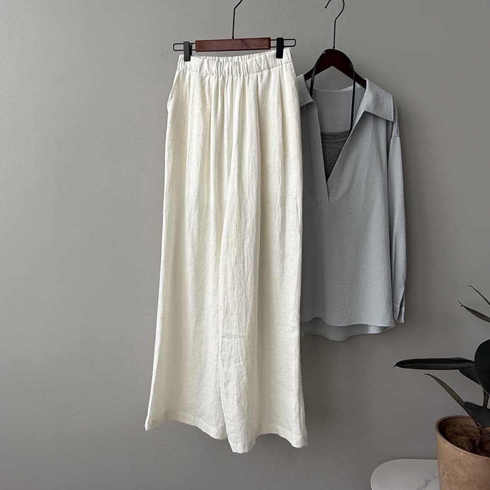 Pantalones anchos drapeados con cintura alta
