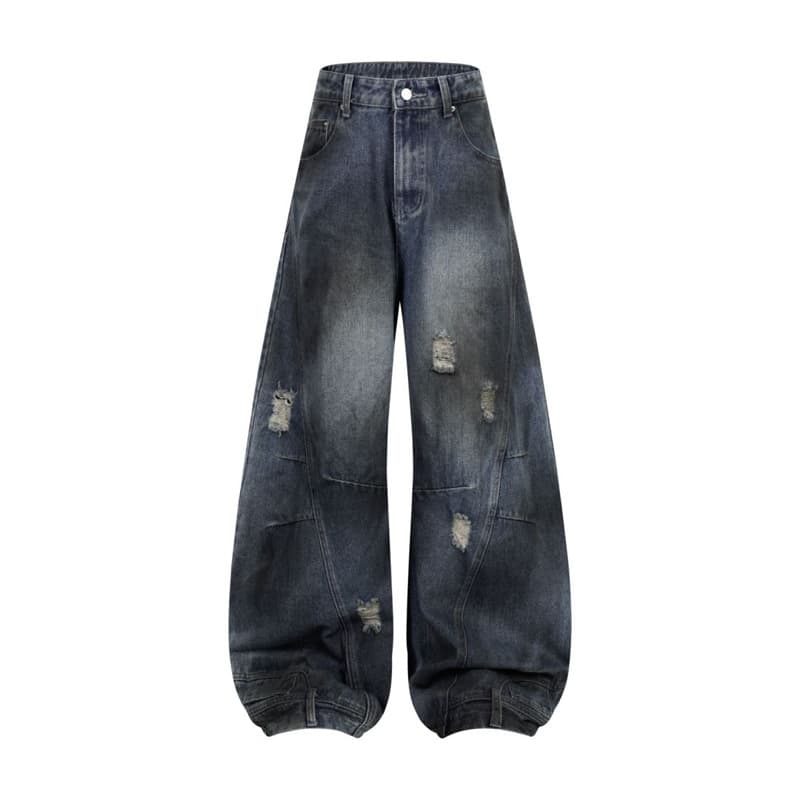 Jeans rectos desgastados con detalles rotos y costura deconstruida