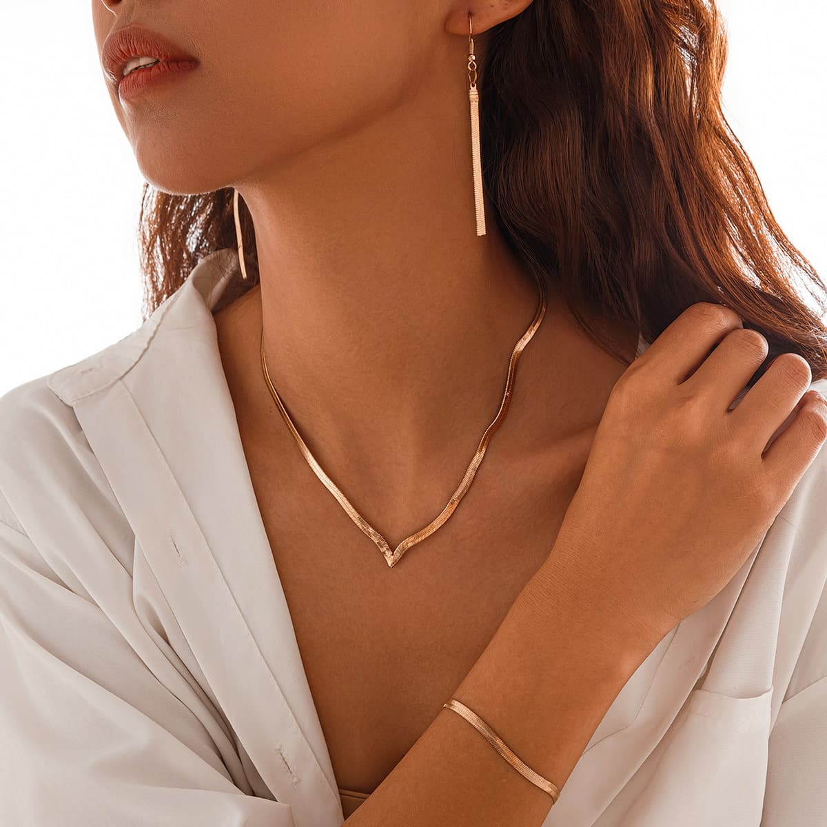 Conjunto de collar, aretes y pulsera geométrico