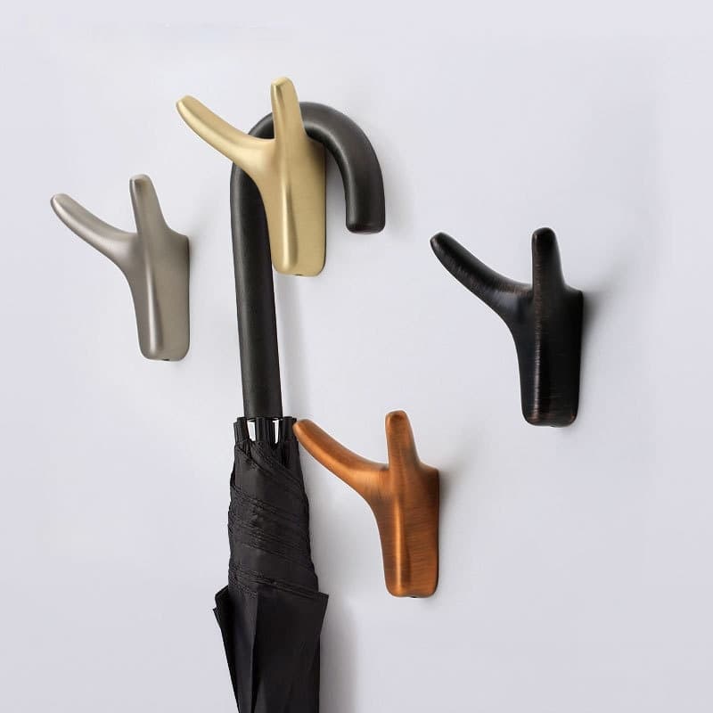 Gancho de pared moderno para ropa y accesorios