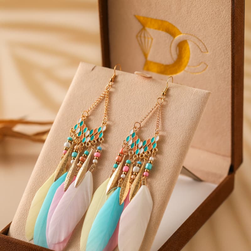 Aretes largos con pluma forma V