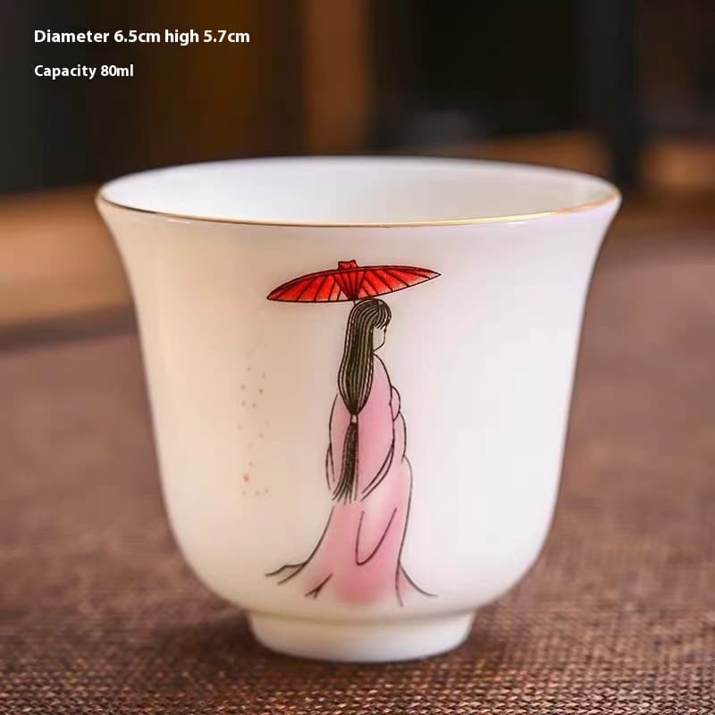 Juego de té de porcelana blanca con decoración dorada