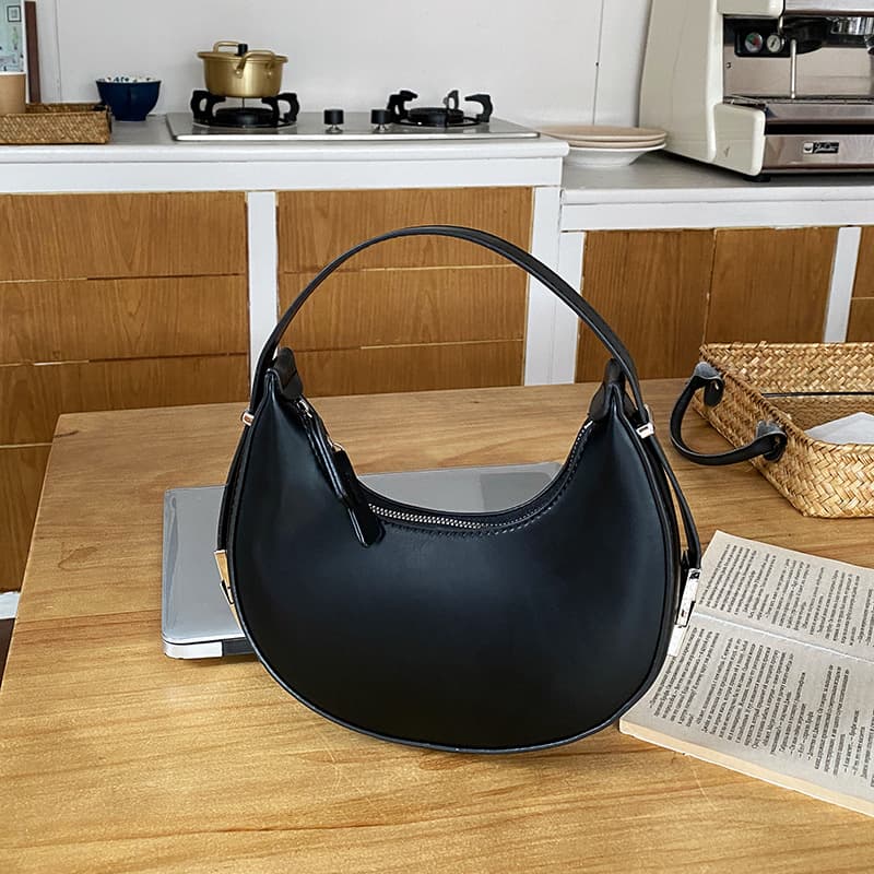 Bolsa redonda pequeña para mujer con cierre de metal