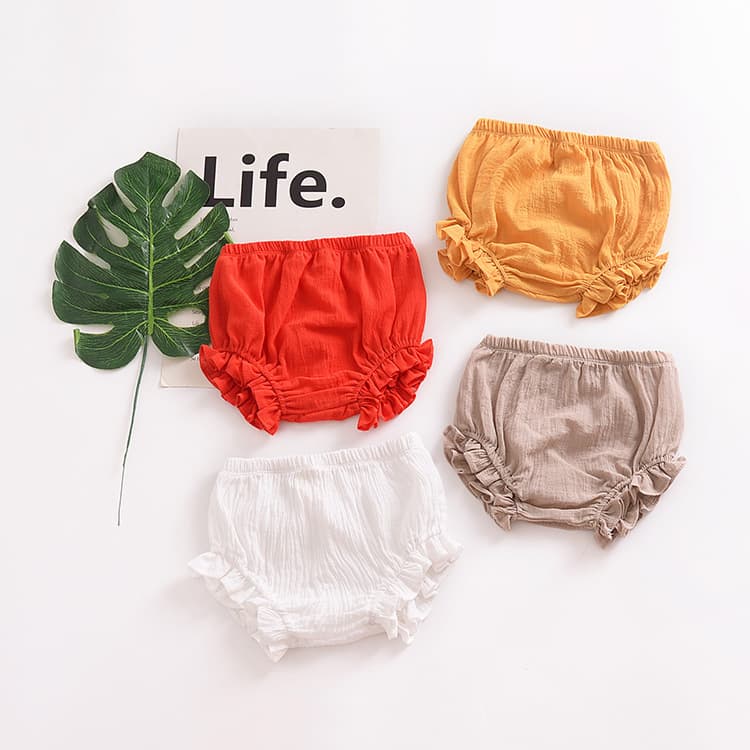 Pantalones cortos de bebé en algodón con encaje