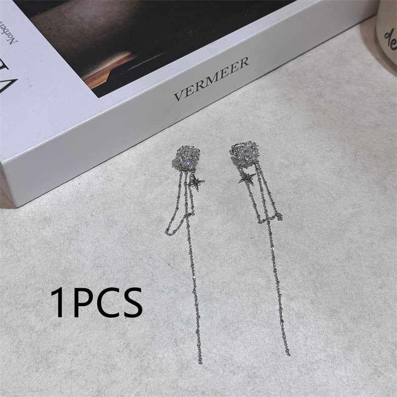 Aretes clip flor con borla y diamantes sin piercing