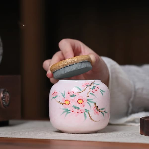 Tarro de té con diseño de flor de durazno pintado a mano