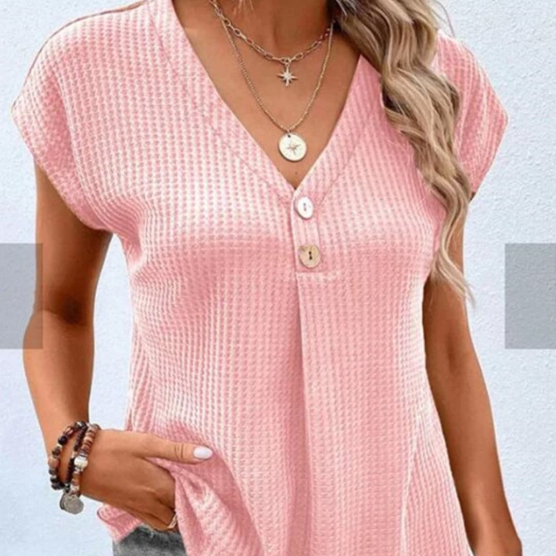 Blusa de botones cuello redondo, manga corta, color sólido