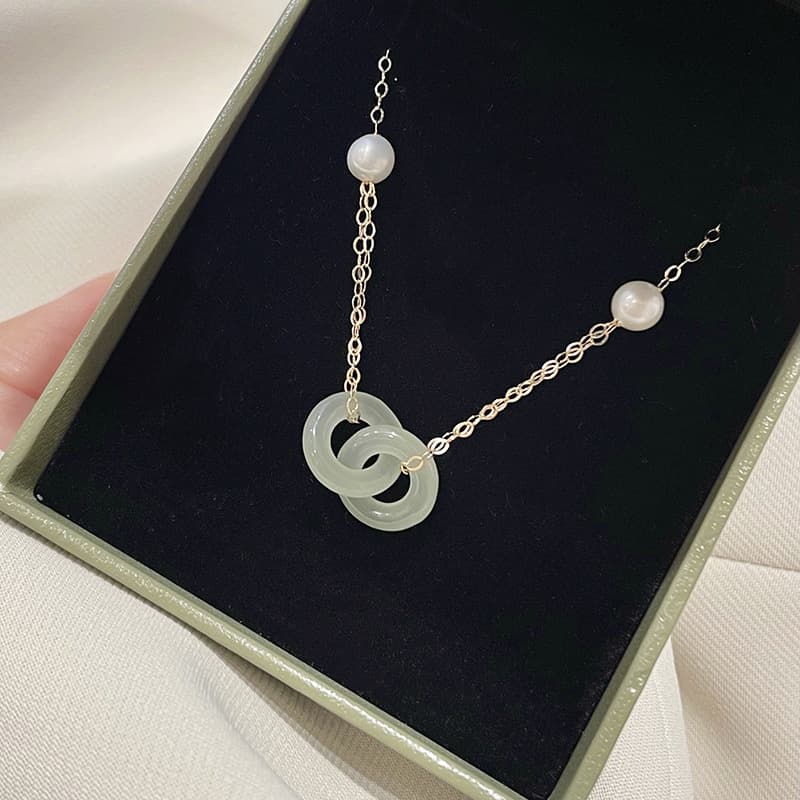 Collar de cadena cruzada con cierre de seguridad y doble anillo
