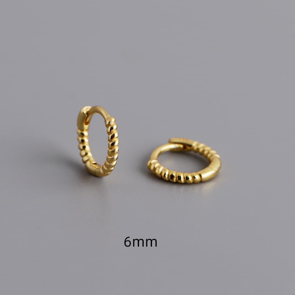 Aretes de plata torcidos estilo anillo
