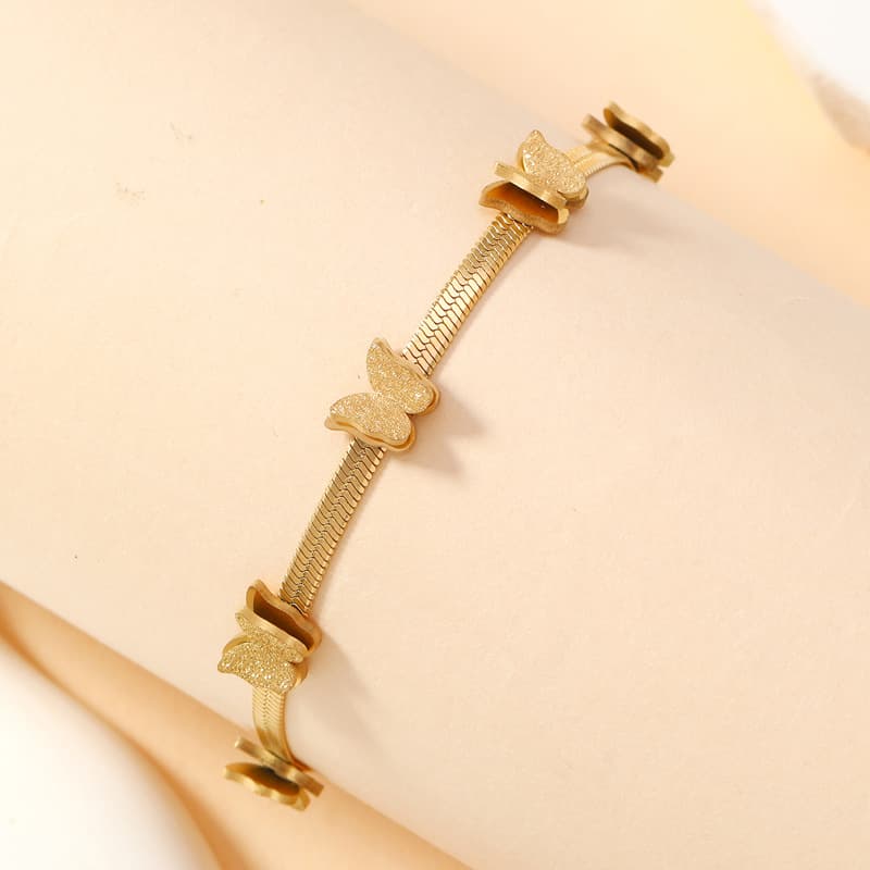 Pulsera de titanio con doble mariposa