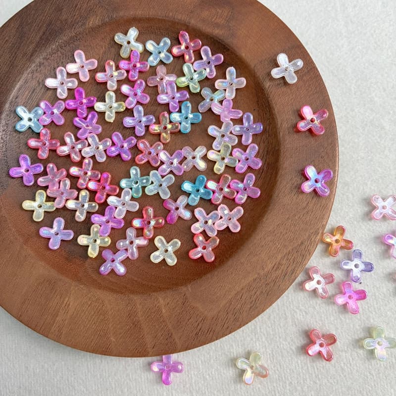 Cuentas de flores acrílicas de 4 pétalos luminiscentes brillantes