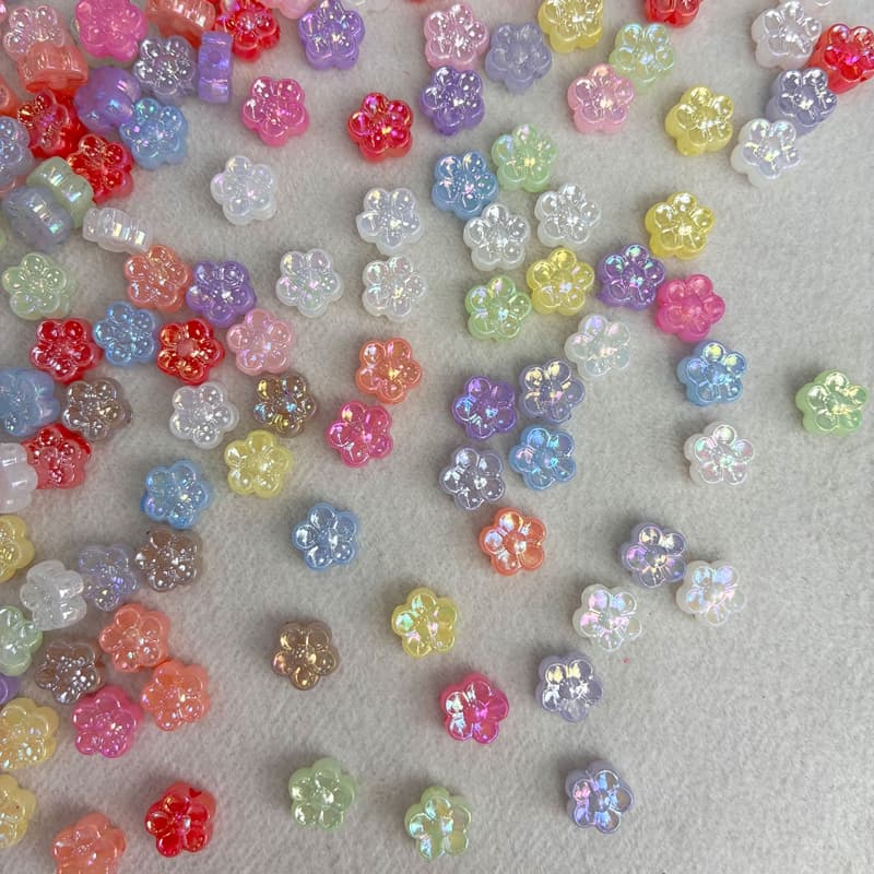 Perlas acrílicas de flores de cinco pétalos con acabado dorado AB