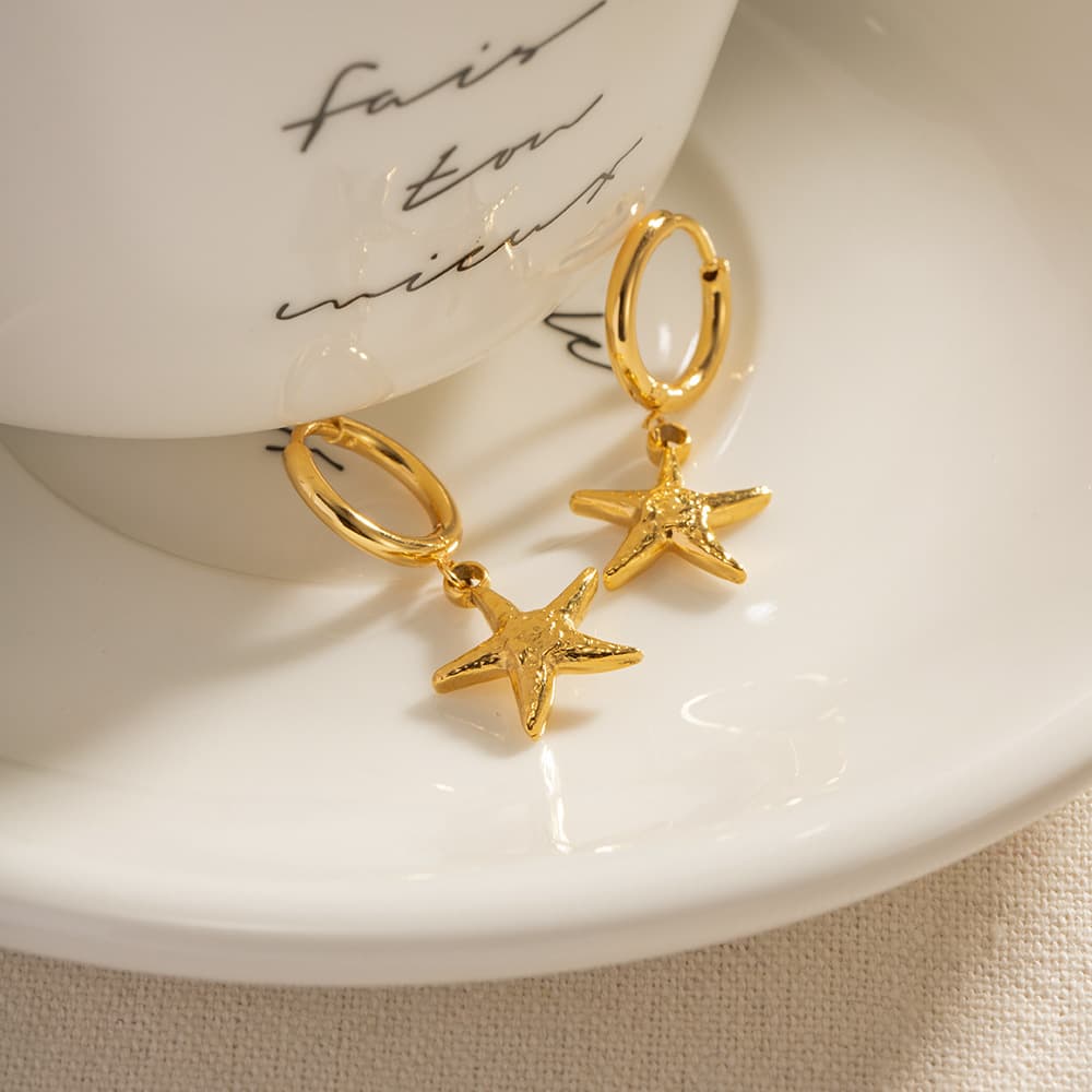 Pendientes estrella de mar acero inoxidable dorado