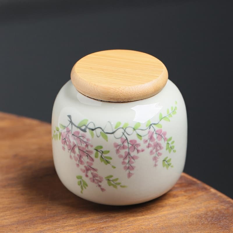 Frasco de té de cerámica pintado a mano con flor de glicina